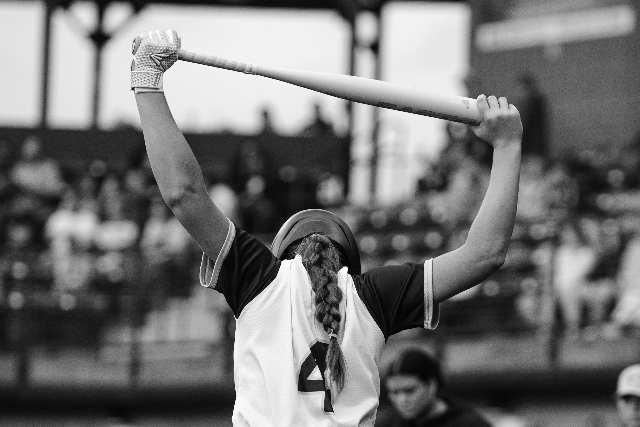 #4 Riley Schwisow stretches before a game against the Minot Honeybees.