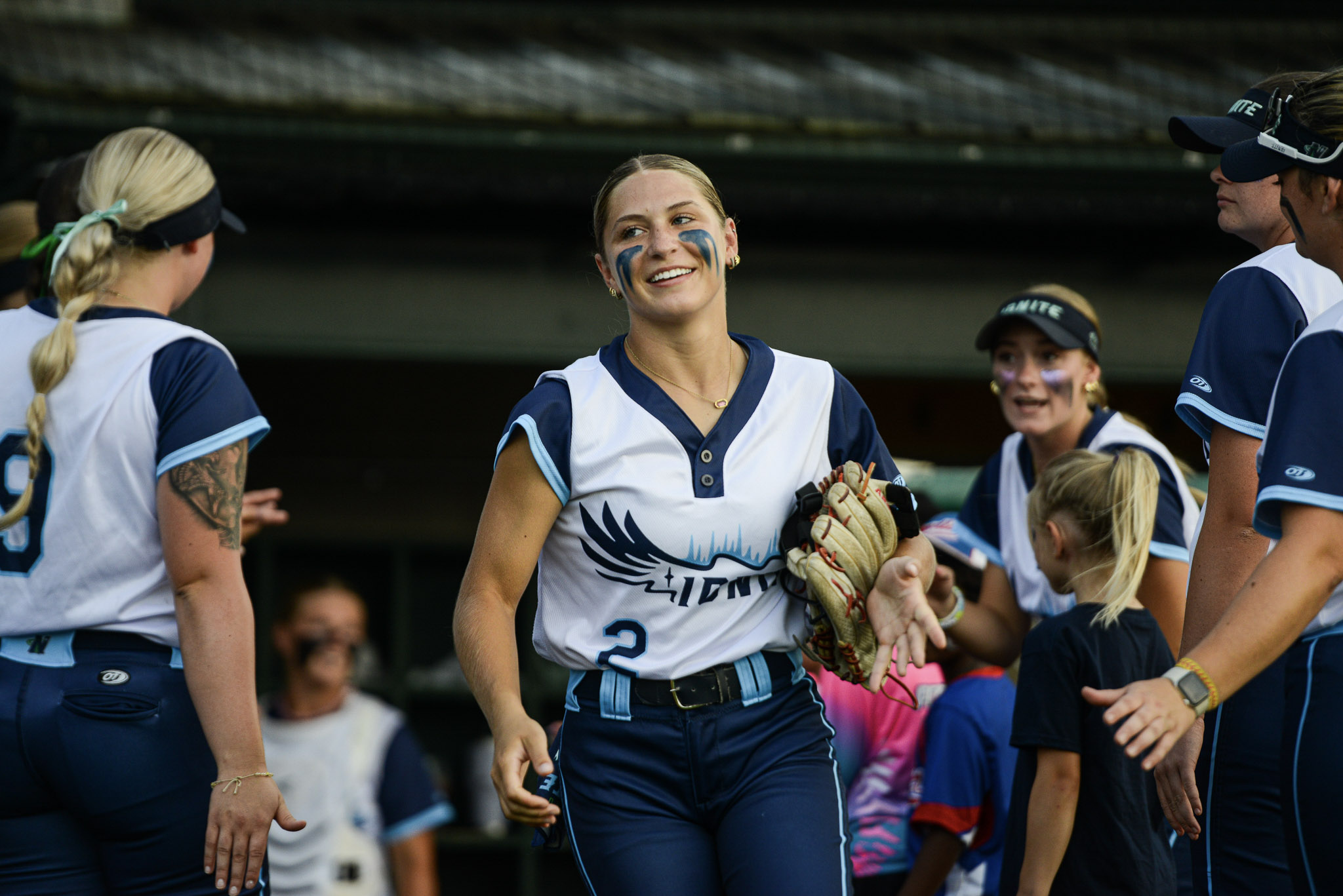 Brooklyn Hofer jogs onto the field in the final home game of the summer.